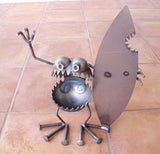 Surfer Holding Shark Bitten Surfboard Gnome Be Gone by Artist Fred Conlon of Sugarpost