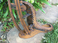 Alligator Holding Wine, Garden Sculpture by Henry Dupere